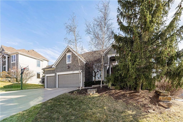 view of front facade featuring concrete driveway, a front lawn, an attached garage, and stucco siding