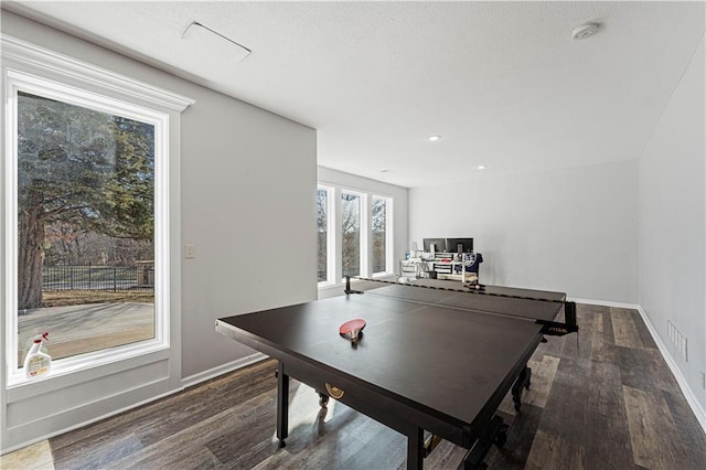 game room featuring baseboards, wood finished floors, and recessed lighting