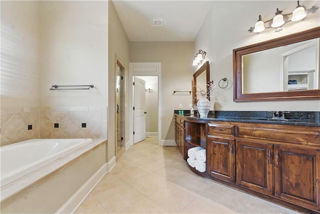 full bathroom featuring tile patterned flooring, double vanity, a bath, a shower stall, and a sink