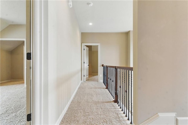 hall with carpet floors and baseboards