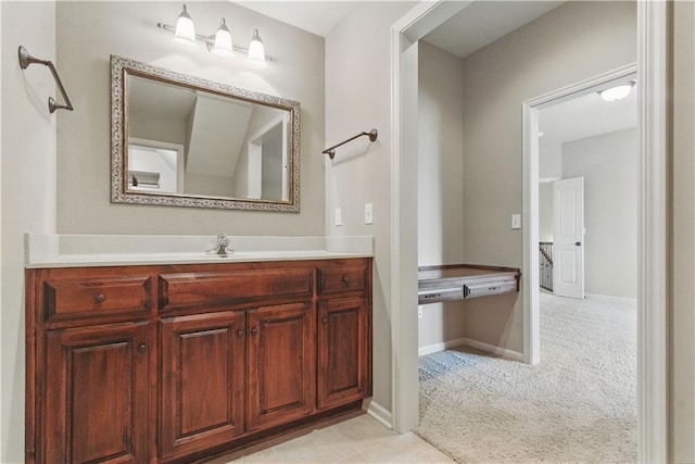 bathroom featuring baseboards and vanity