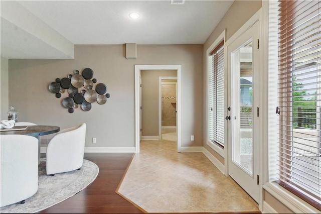 dining space with baseboards and recessed lighting