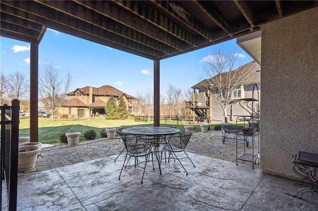view of patio with a residential view and outdoor dining space