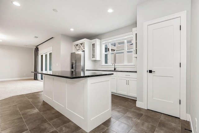 16649 S Tomashaw St, Olathe, KS 66062 - kitchen featuring glass insert cabinets, a sink, dark countertops, stainless steel refrigerator with ice dispenser, and recessed lighting