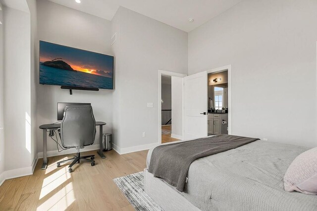 16649 S Tomashaw St, Olathe, KS 66062 - bedroom with light wood-type flooring, baseboards, and a towering ceiling