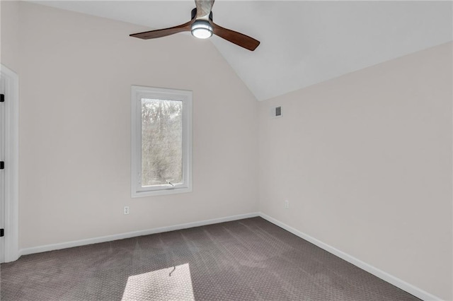 unfurnished room with baseboards, visible vents, a ceiling fan, lofted ceiling, and dark carpet