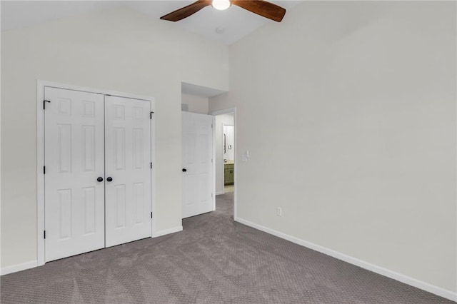 unfurnished bedroom featuring ceiling fan, a closet, carpet, and baseboards