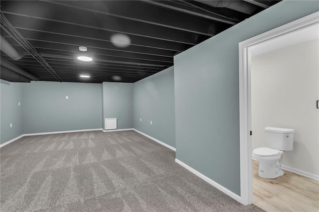 finished below grade area featuring carpet and baseboards