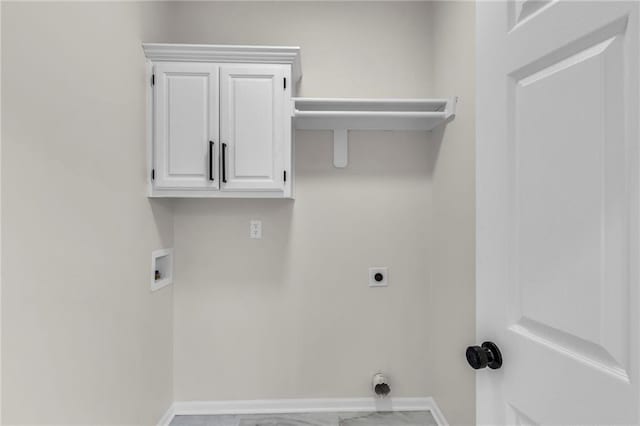 laundry area with hookup for an electric dryer, washer hookup, baseboards, marble finish floor, and cabinet space