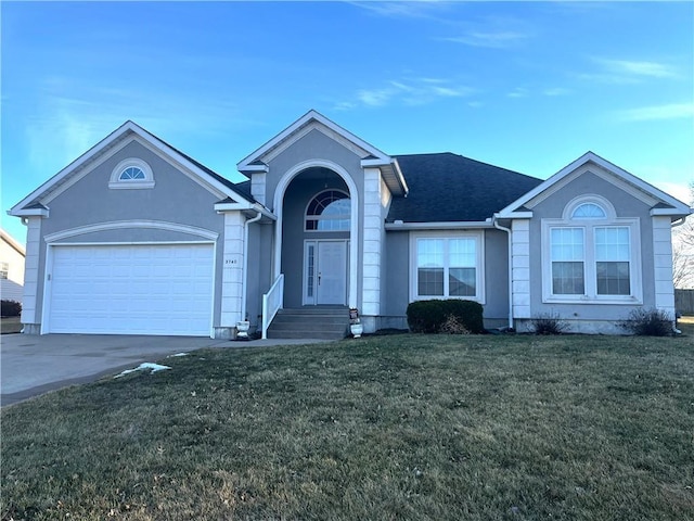 ranch-style house featuring a garage, stucco siding, driveway, and a front yard