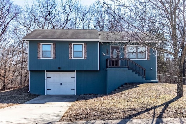 view of front facade featuring concrete driveway and an attached garage