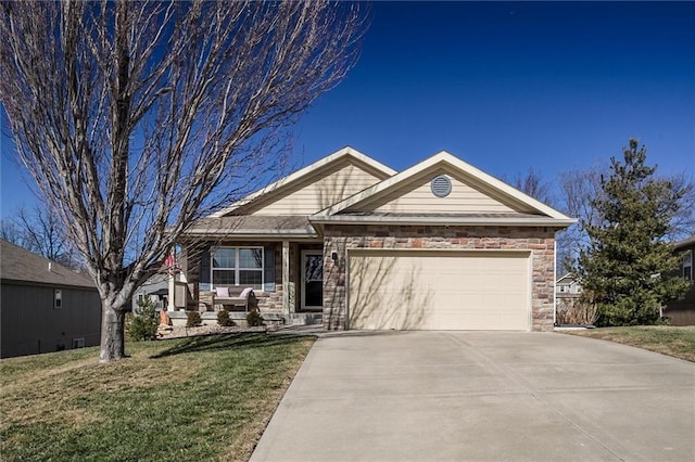 view of front facade featuring an attached garage, concrete driveway, stone siding, and a front yard