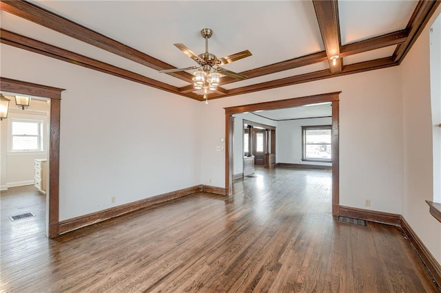 empty room with ceiling fan, baseboards, a healthy amount of sunlight, and wood finished floors