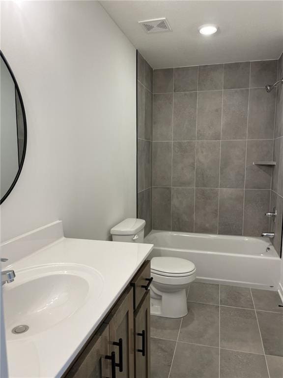 full bath featuring visible vents, toilet, vanity,  shower combination, and tile patterned flooring