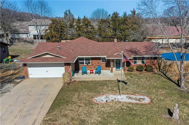 ranch-style house with a garage, concrete driveway, fence, a front lawn, and brick siding