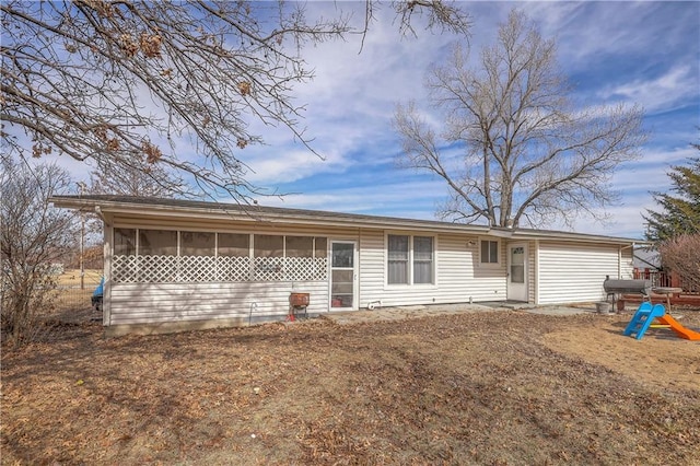 back of house with a sunroom