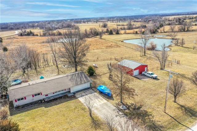 birds eye view of property with a rural view