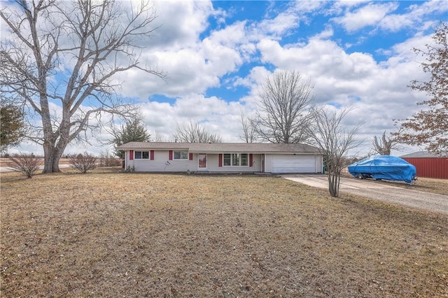 single story home with a front lawn, driveway, and an attached garage