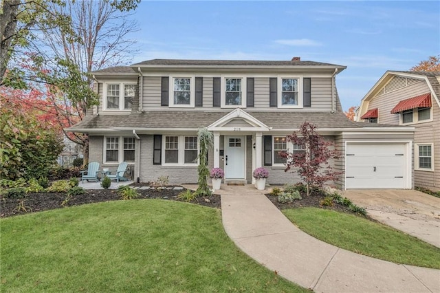 view of front of house featuring brick siding, roof with shingles, concrete driveway, an attached garage, and a front lawn