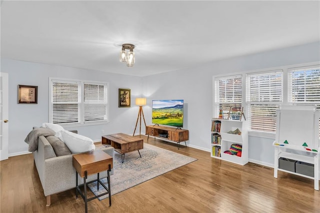 living room with wood finished floors and baseboards