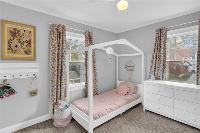 bedroom with carpet floors, ceiling fan, and baseboards