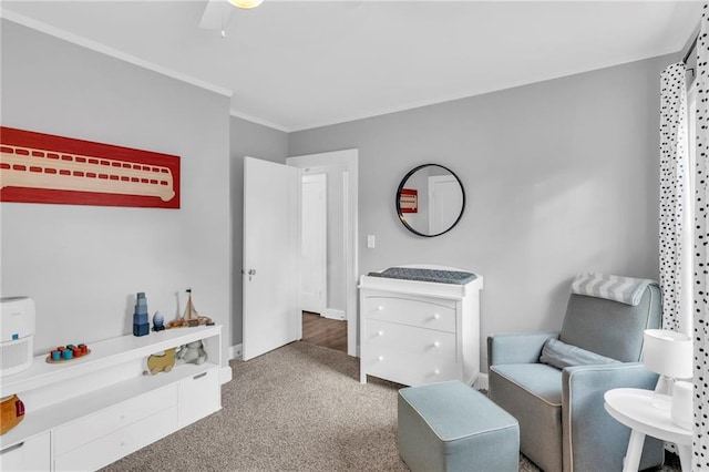 living area featuring ornamental molding, carpet flooring, and baseboards