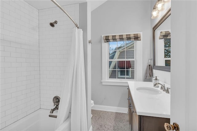 full bathroom with shower / tub combo with curtain, toilet, vanity, baseboards, and tile patterned floors