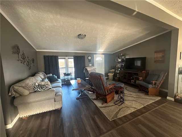 living room with a textured ceiling, ornamental molding, vaulted ceiling, and wood finished floors