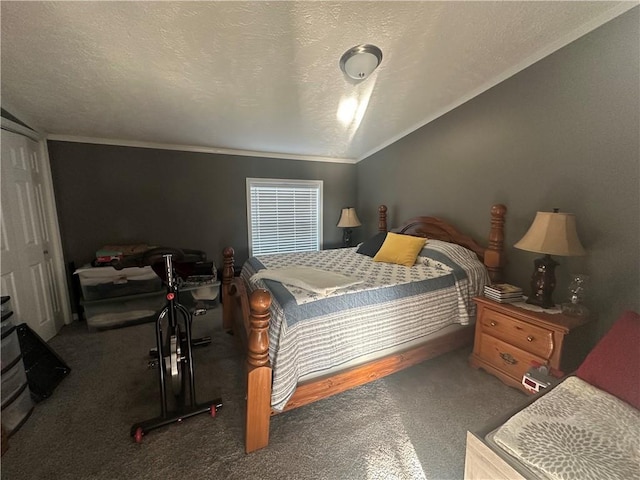 carpeted bedroom with a textured ceiling and vaulted ceiling