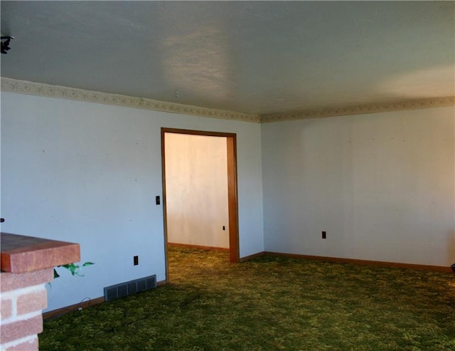 carpeted empty room with baseboards and visible vents