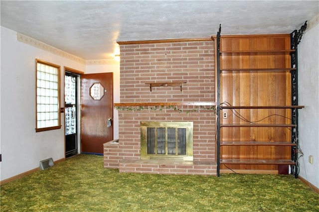 interior space with baseboards, a fireplace, visible vents, and carpet flooring