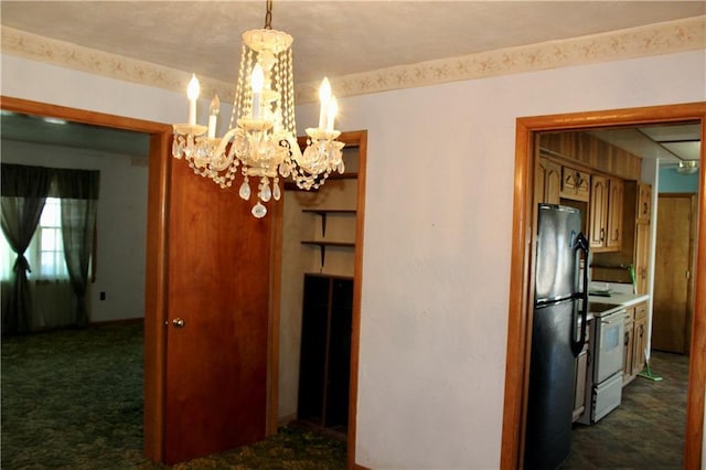 interior space with dark colored carpet and an inviting chandelier