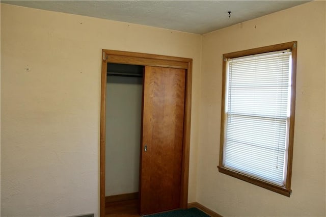 unfurnished bedroom with a closet