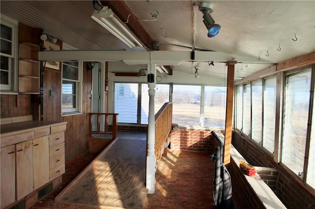 interior space featuring lofted ceiling and visible vents