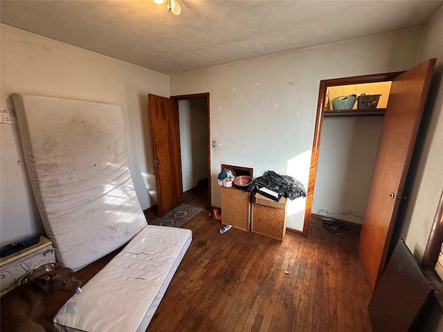 bedroom with hardwood / wood-style floors