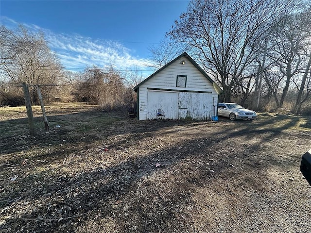 view of property exterior with an outdoor structure