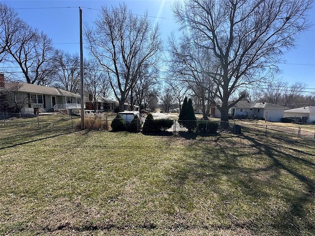 view of yard featuring a residential view and a fenced front yard