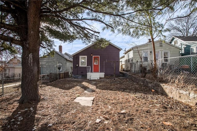 back of property featuring fence