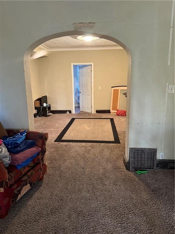 interior space with crown molding, arched walkways, and carpet floors