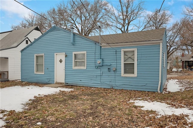 1911 E 69th Ter, Kansas City, MO 64132 - bungalow-style house with roof with shingles