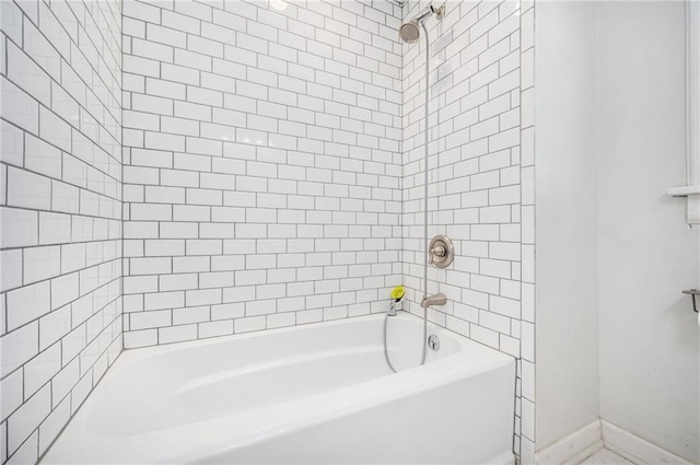 full bath featuring shower / tub combination and baseboards