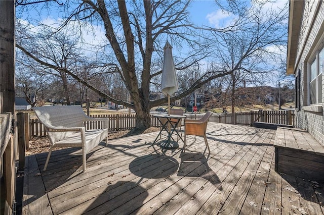 wooden terrace featuring outdoor dining area