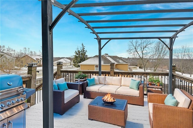 wooden terrace with an outdoor living space with a fire pit, area for grilling, and a pergola