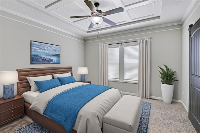 bedroom featuring a barn door, baseboards, a ceiling fan, crown molding, and carpet flooring