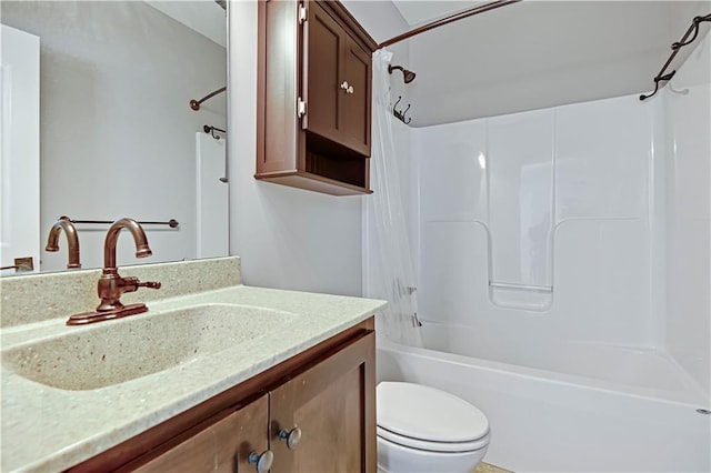 bathroom with shower / bathing tub combination, vanity, and toilet