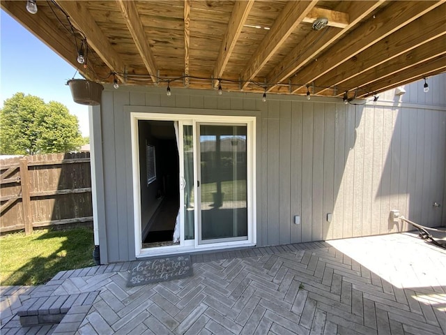 view of patio / terrace featuring fence