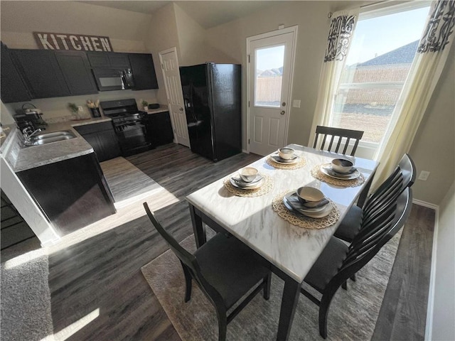 dining room featuring dark wood finished floors and baseboards