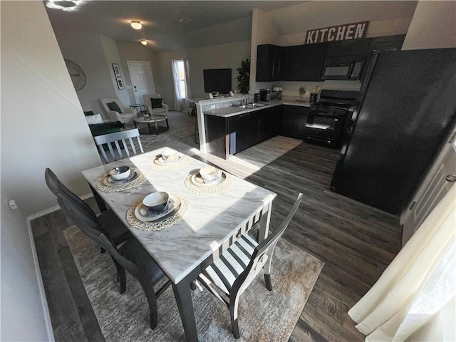 dining space with baseboards and dark wood-style flooring