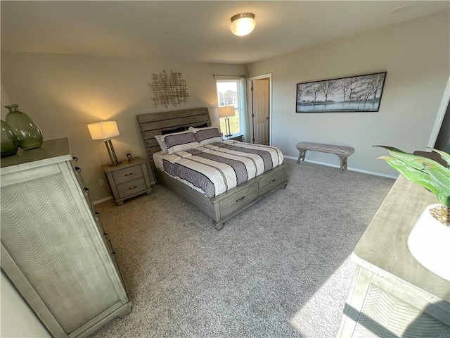 bedroom featuring baseboards and carpet flooring