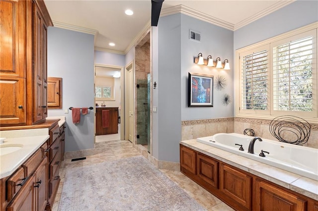 bathroom featuring ornamental molding, a stall shower, a garden tub, and visible vents